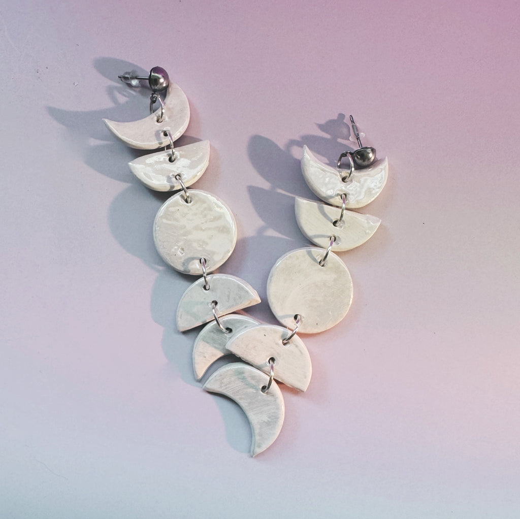 ceramic moon phase statement earrings